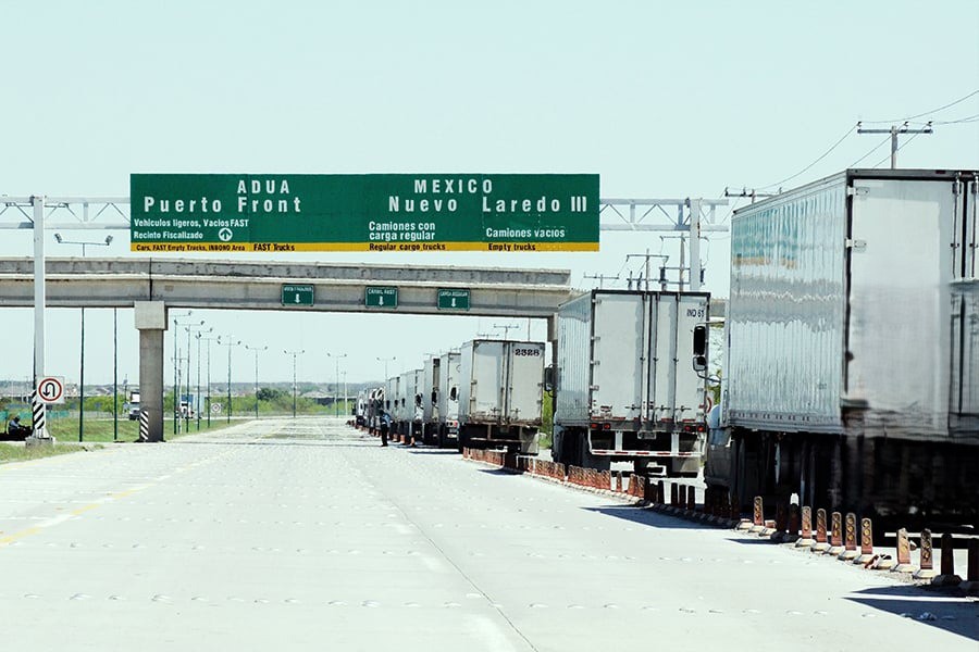 commercial trucls lined up at cross borders